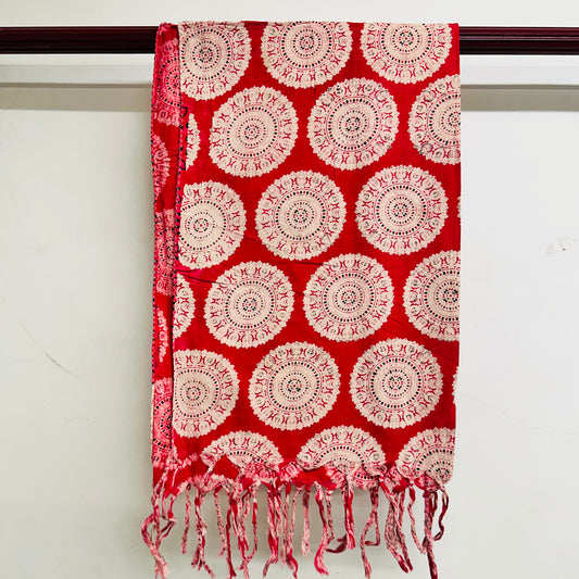 Red scarf with white circular patterns