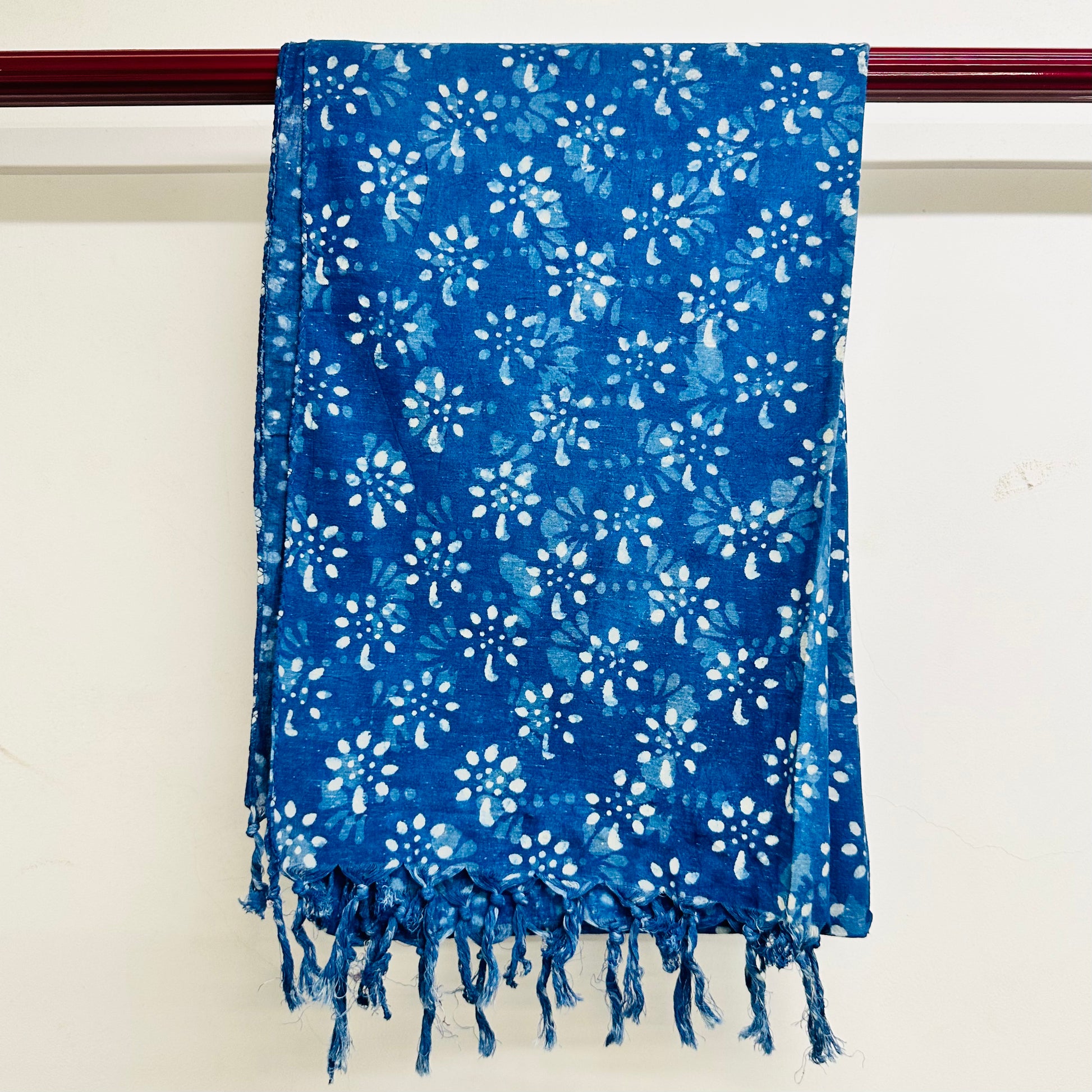 Blue floral patterned scarf with white flowers
