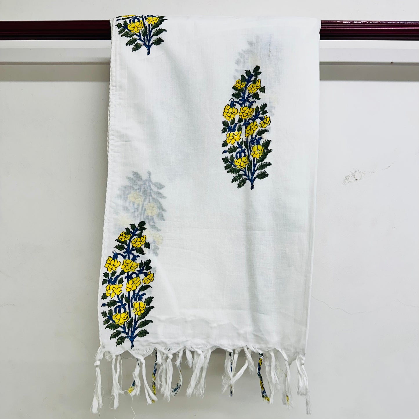 White scarf with yellow floral print