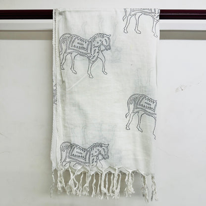 White scarf with black horse patterns and fringes on a whit