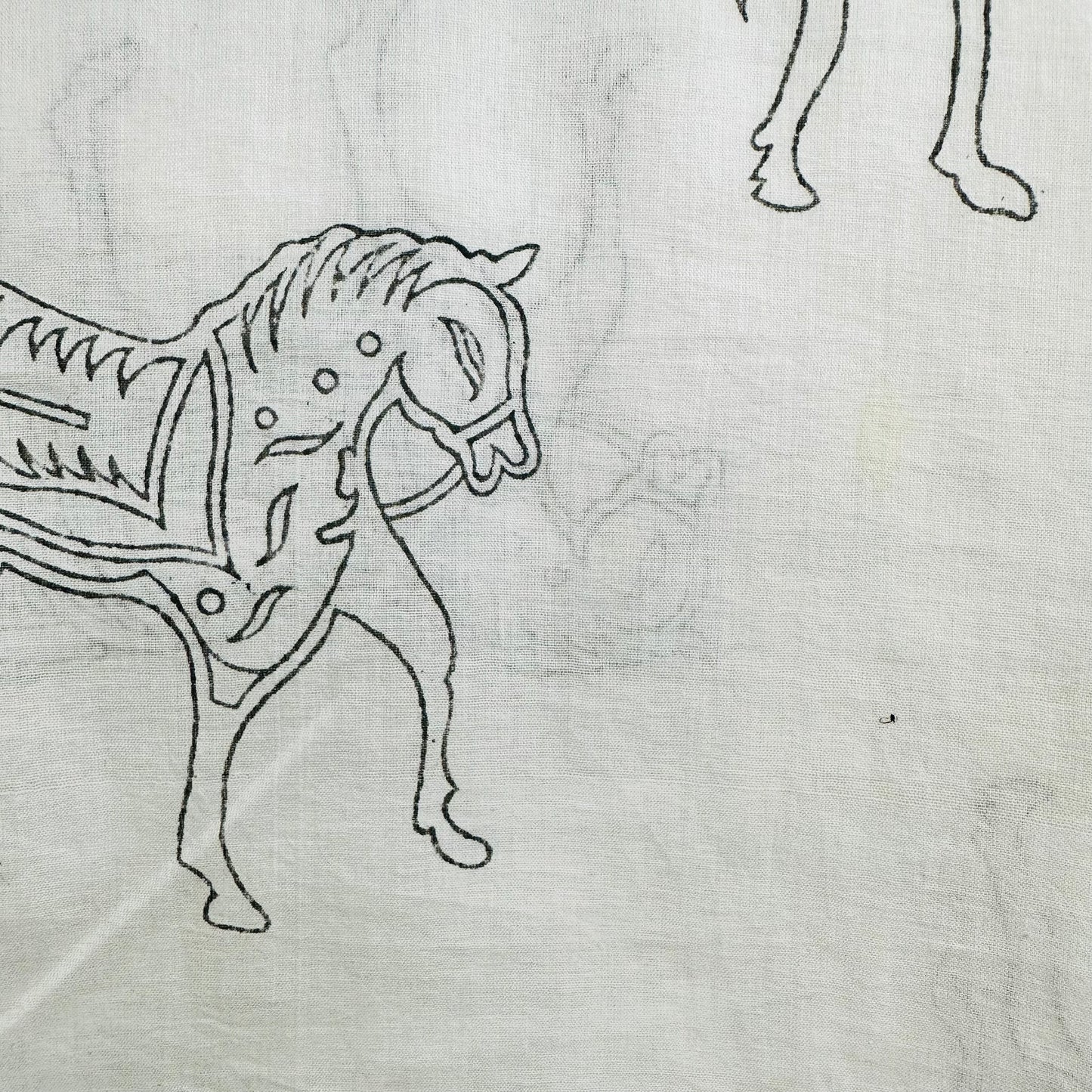 White Cotton scarf with black horse patterns and fringes on a whit