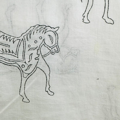 White Cotton scarf with black horse patterns and fringes on a whit