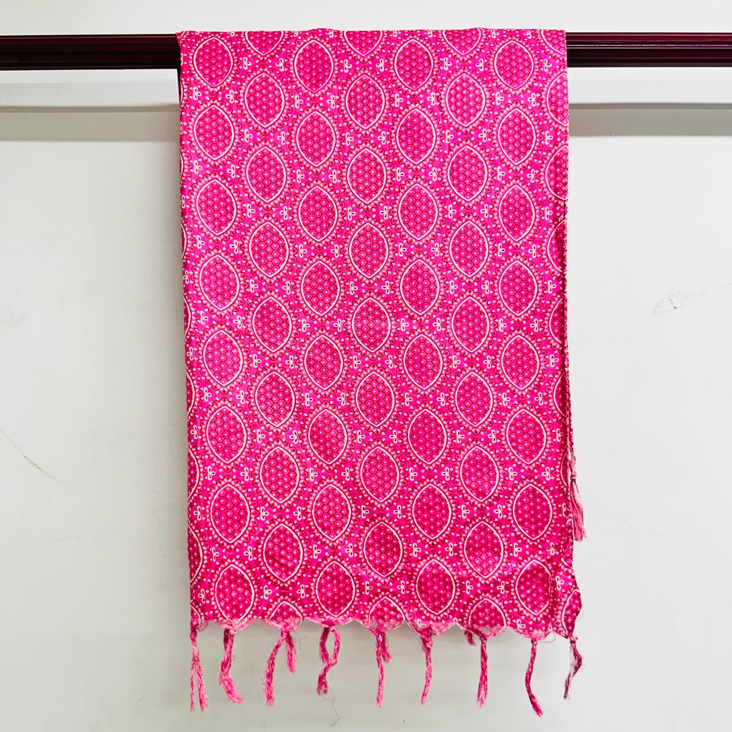 Pink patterned scarf with white dots and circles