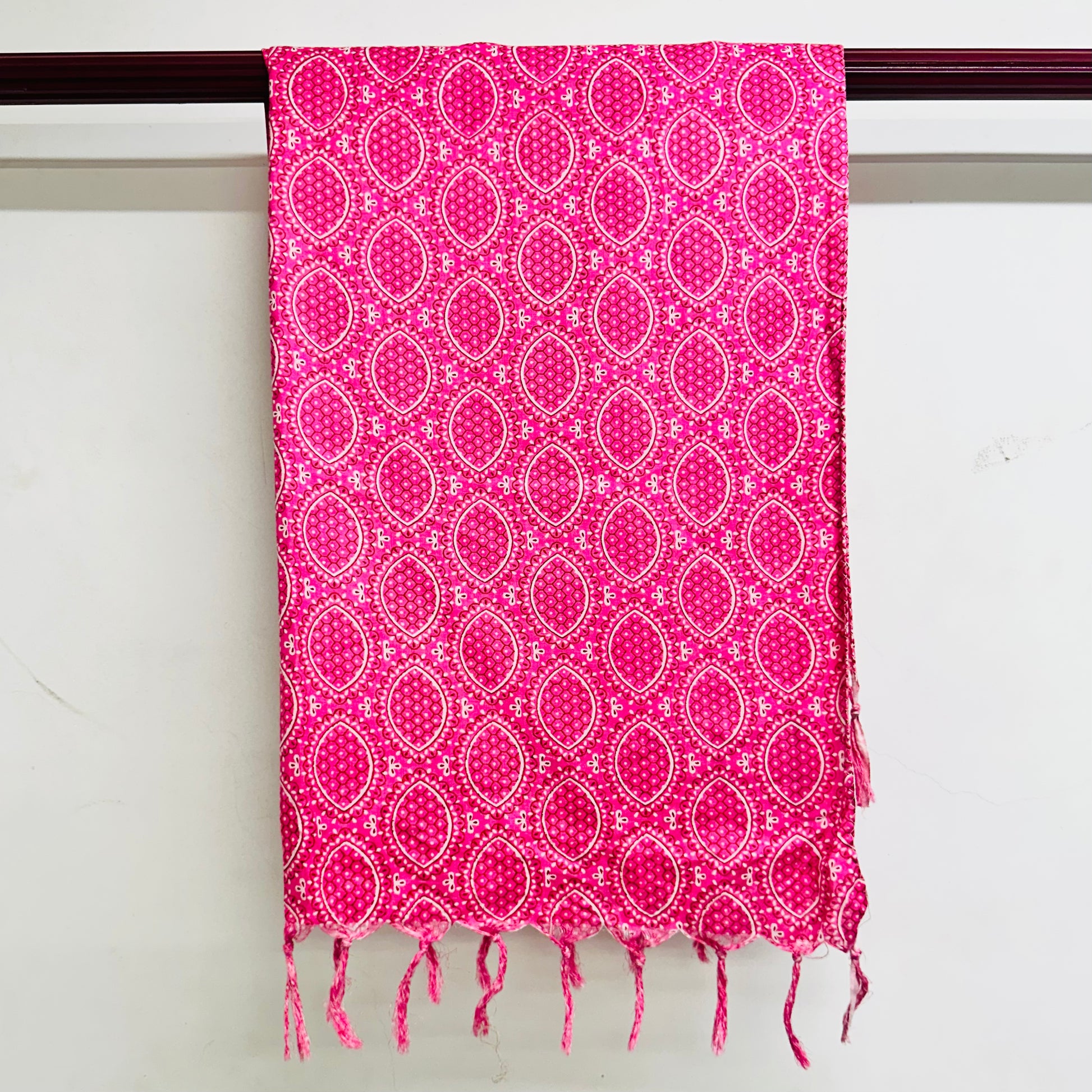 Pink patterned scarf with white dots and circles