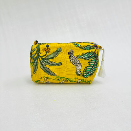 Yellow printed with green leaf and bird pattern on a white background