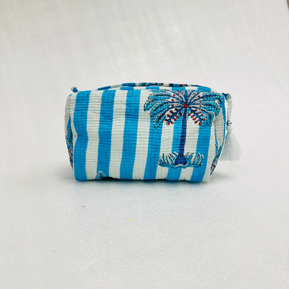 Blue and white striped pouch with palm tree design on a light gray background