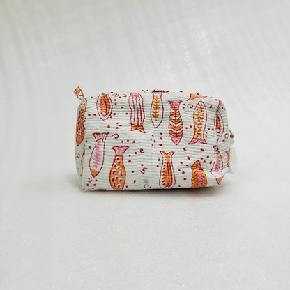 Fabric pouch with fish pattern on a light gray background