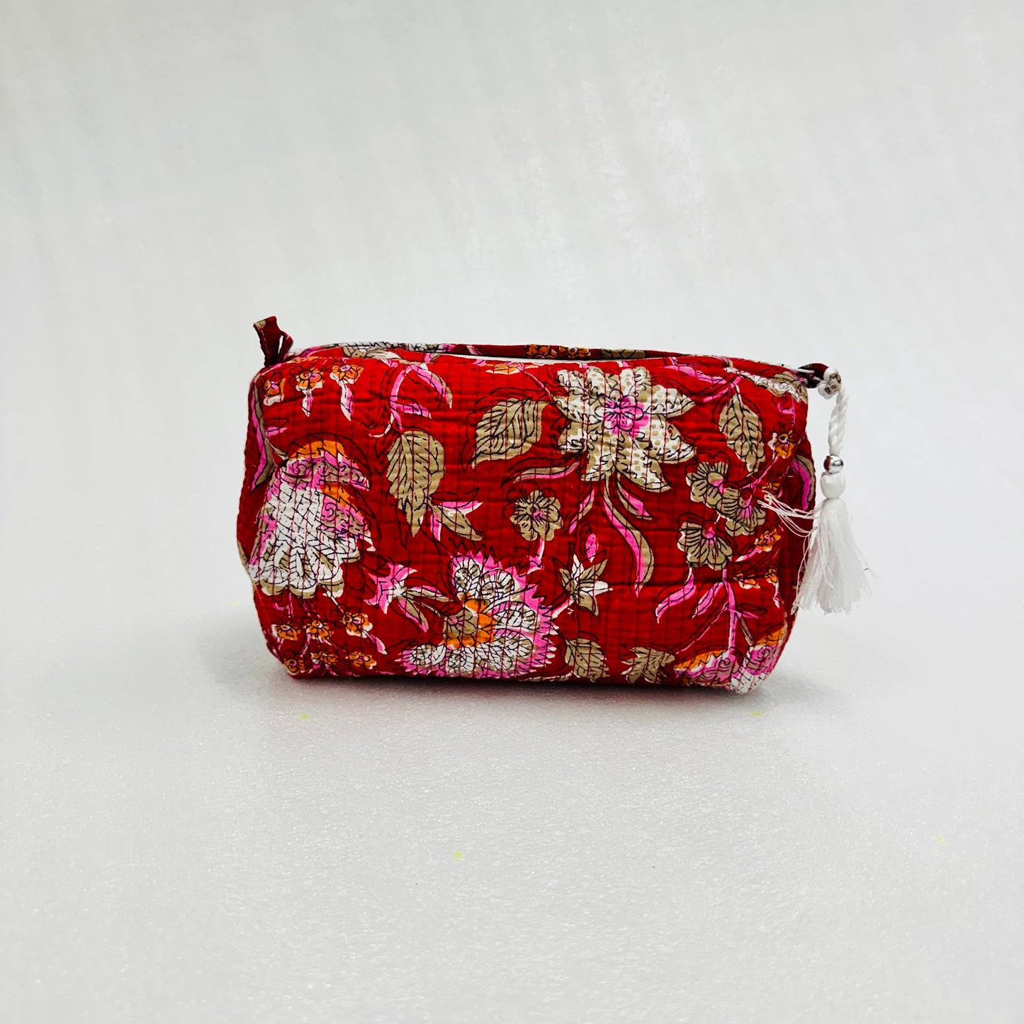 Floral patterned pouch on a white background