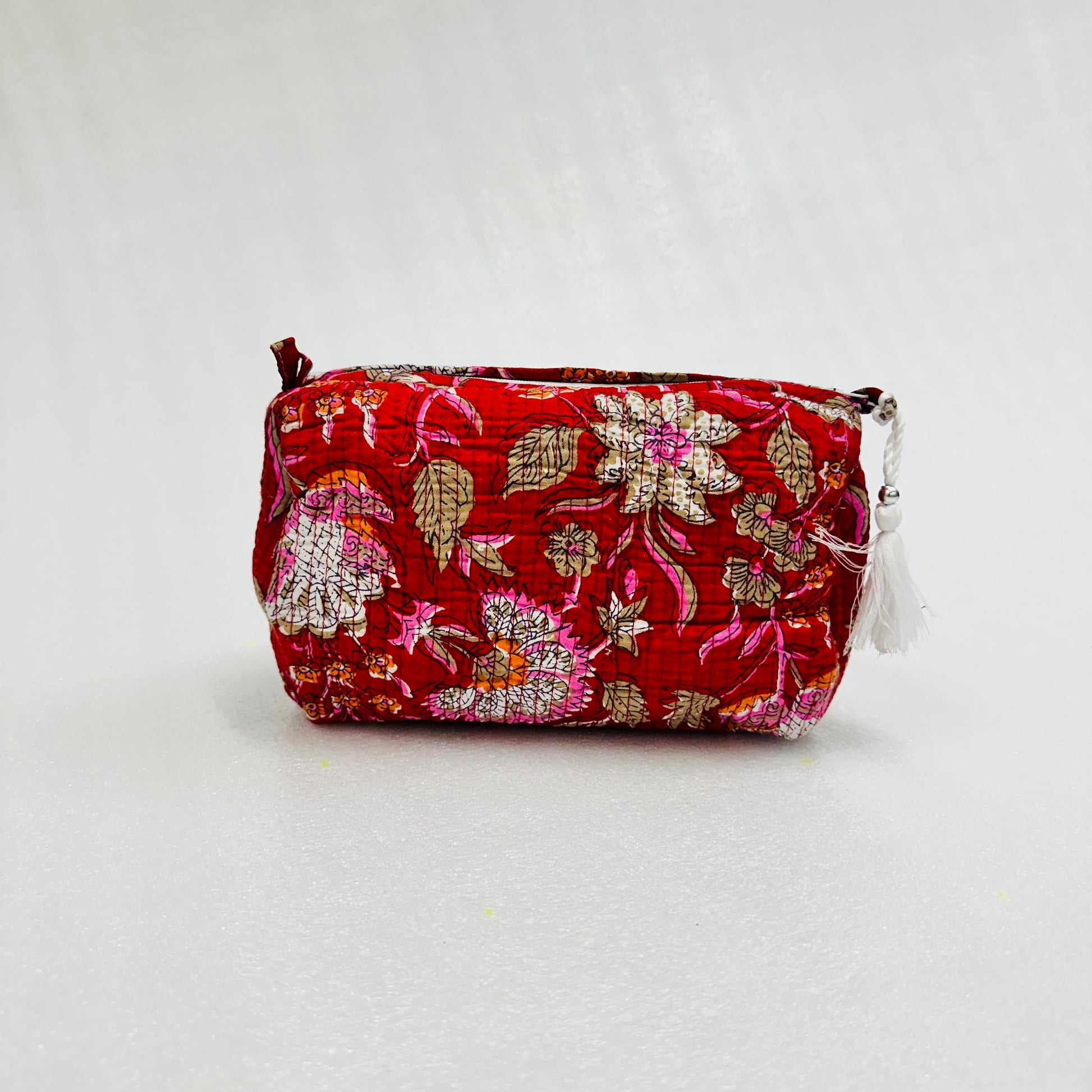 Floral patterned pouch on a white background