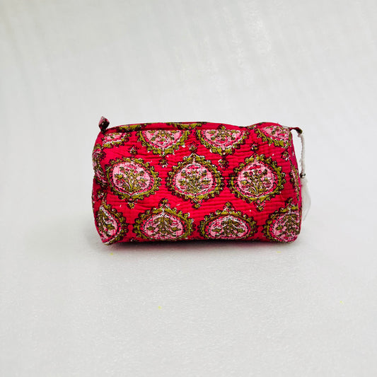 Red patterned pouch on a light gray background